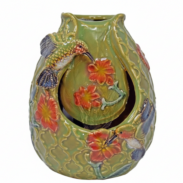 Decorative ceramic vase with hummingbird and floral designs on a white background